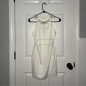 the clothing company Elegant White Cutout Beaded Sleeveless Dress